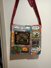 Load image into Gallery viewer, Mostly Peace bag handmade from recycled materials by me.