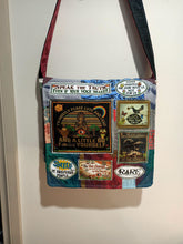 Load image into Gallery viewer, Mostly Peace bag handmade from recycled materials by me.